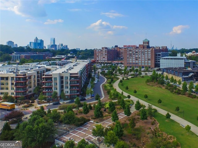 birds eye view of property featuring a city view