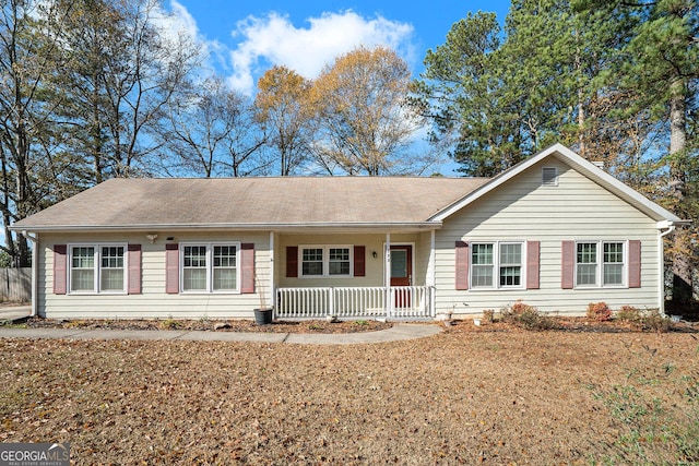 ranch-style home featuring a porch