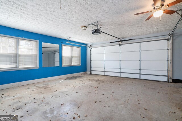 garage featuring a garage door opener and ceiling fan