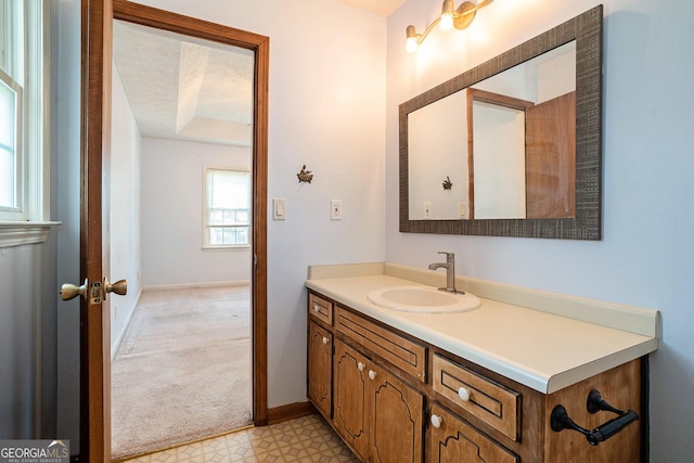 bathroom with vanity and a textured ceiling