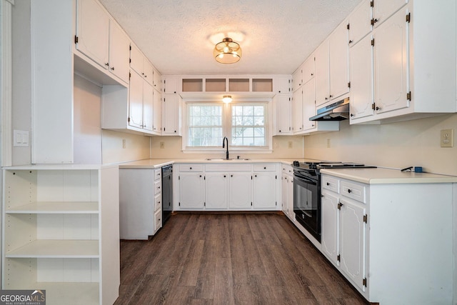 kitchen featuring white cabinetry, sink, black range oven, dark wood-type flooring, and a textured ceiling