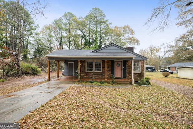 bungalow featuring a carport