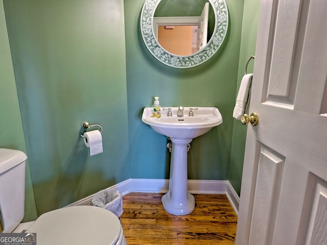 bathroom featuring toilet and hardwood / wood-style floors