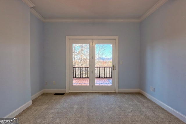 carpeted spare room with ornamental molding