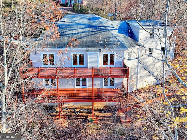 rear view of house featuring a balcony