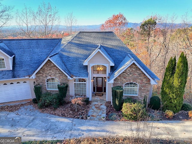 view of front of house featuring a garage and a mountain view