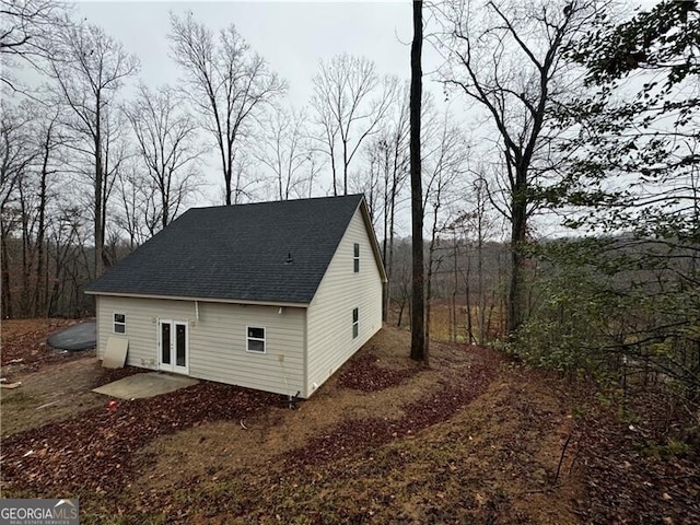 view of property exterior featuring french doors