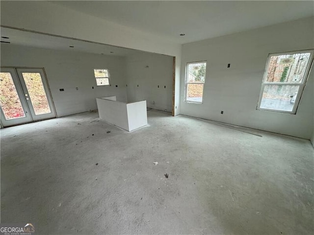 spare room with french doors and plenty of natural light