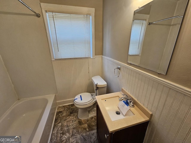 full bathroom featuring tub / shower combination, vanity, and toilet