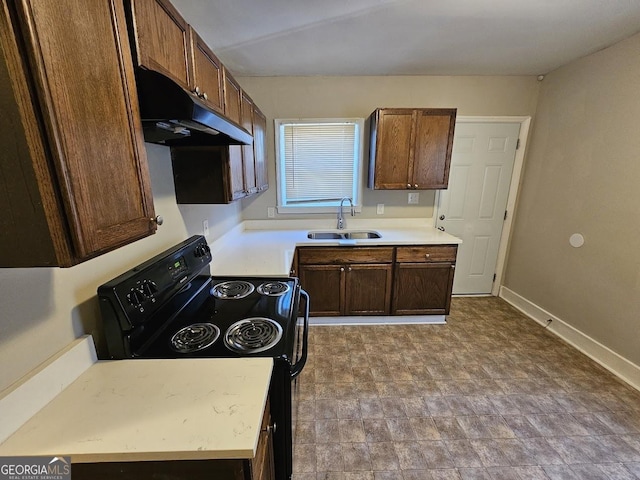 kitchen featuring black / electric stove and sink