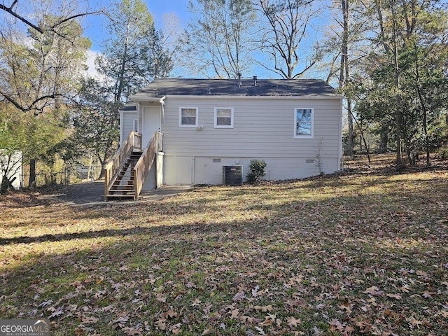 back of house featuring central AC unit