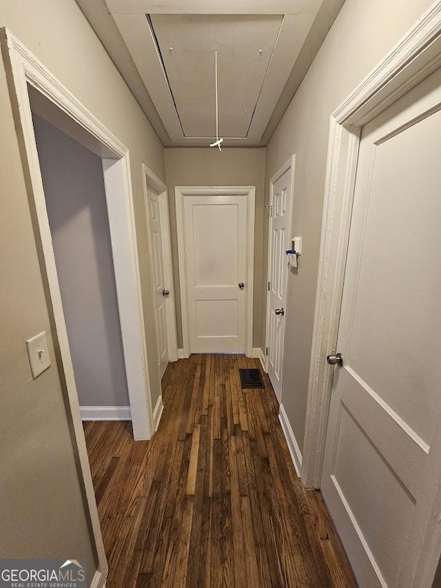 hall featuring dark wood-type flooring