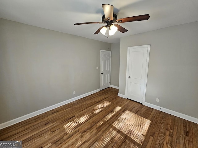 unfurnished bedroom with ceiling fan and hardwood / wood-style floors