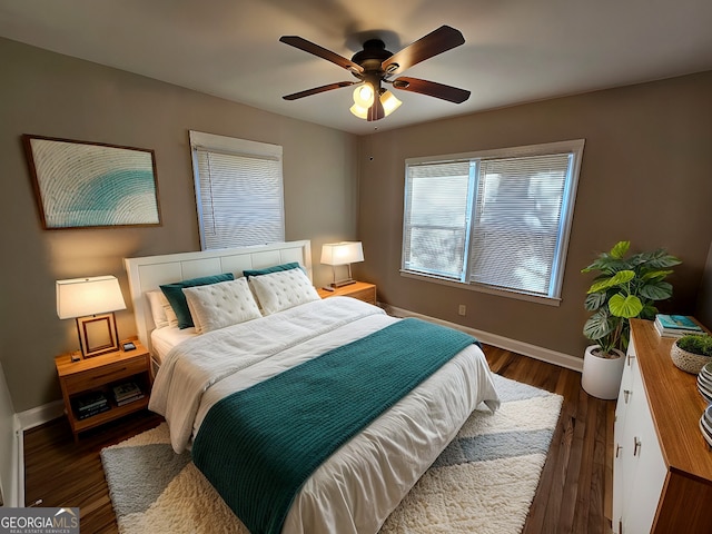 bedroom featuring ceiling fan and dark hardwood / wood-style floors