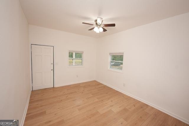 unfurnished room with ceiling fan and light hardwood / wood-style flooring