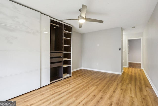 unfurnished bedroom featuring light hardwood / wood-style floors and ceiling fan