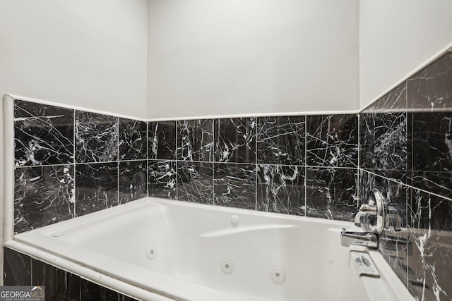 bathroom featuring tiled bath