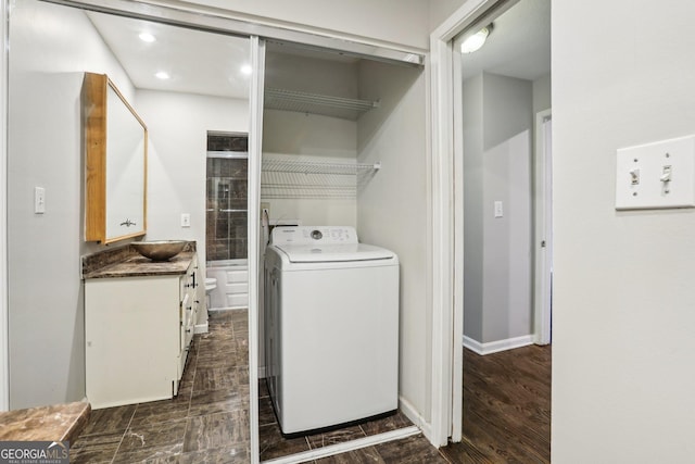 washroom featuring washer / dryer and dark wood-type flooring