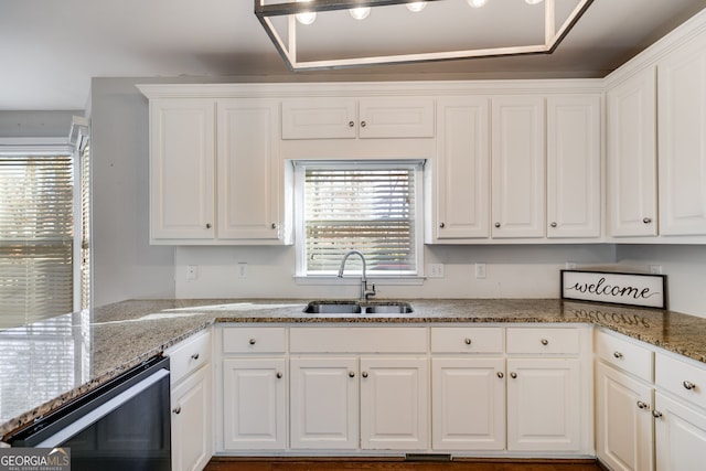 kitchen featuring white cabinetry, sink, light stone counters, and wine cooler