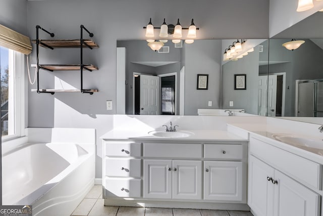 bathroom with vanity, tile patterned flooring, and shower with separate bathtub