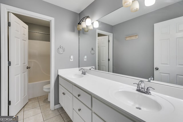 full bathroom featuring vanity, tub / shower combination, tile patterned floors, and toilet