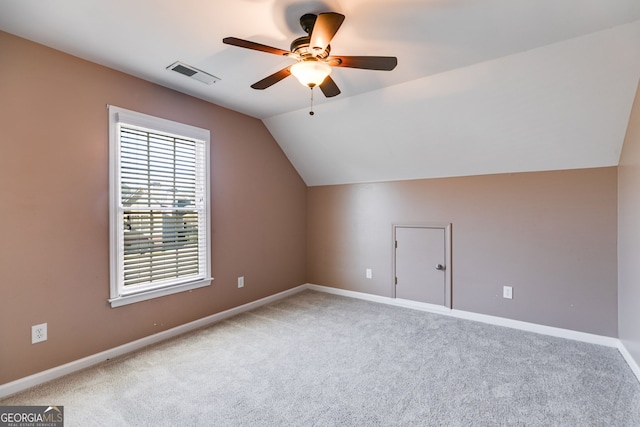 additional living space featuring vaulted ceiling, ceiling fan, and carpet