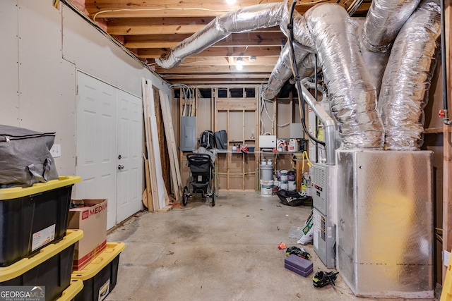 basement with heating unit and electric panel