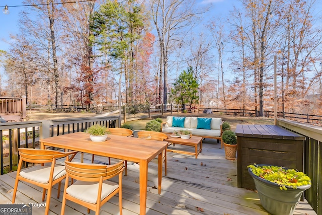 wooden terrace featuring outdoor lounge area