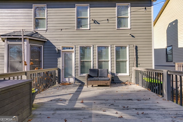 deck featuring outdoor lounge area