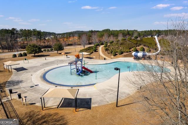 view of pool with a water slide