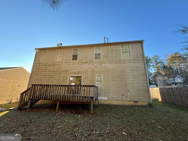 back of property featuring a deck