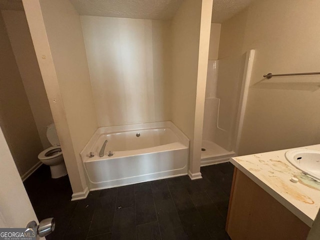 full bathroom featuring vanity, a textured ceiling, hardwood / wood-style flooring, plus walk in shower, and toilet