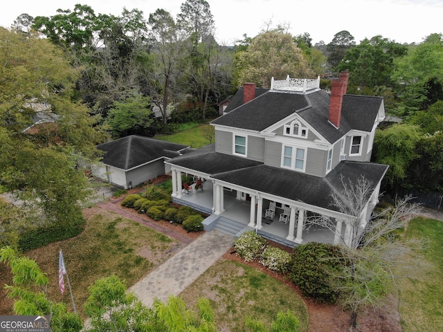 exterior space featuring a yard and covered porch