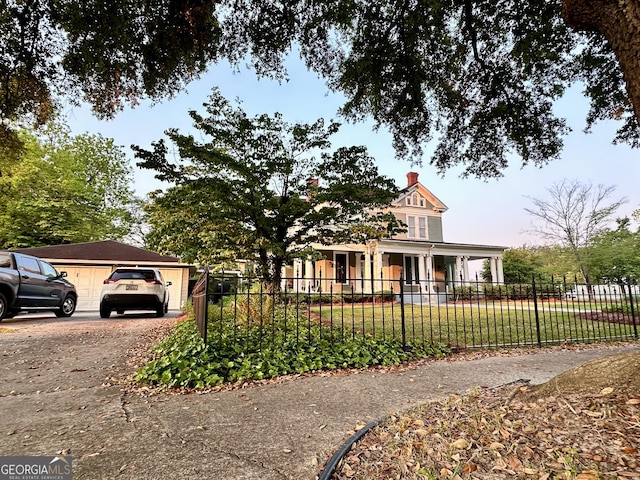 view of front of property featuring a yard and covered porch