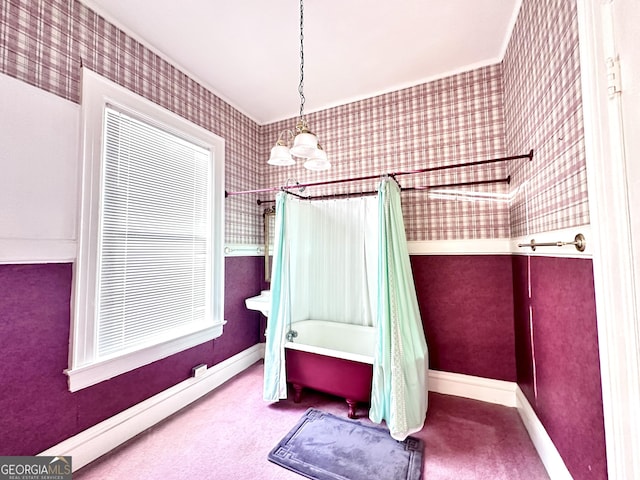 bathroom featuring shower / tub combo and a chandelier