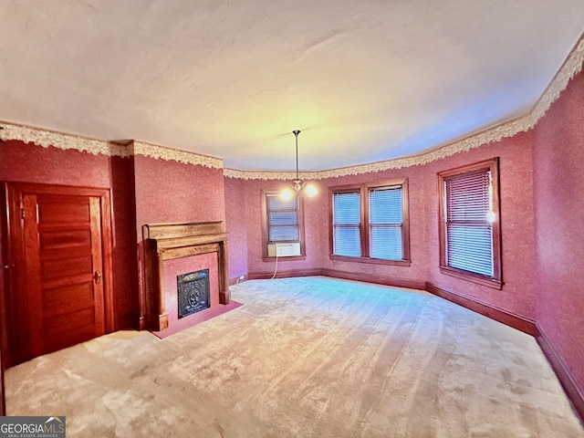 unfurnished living room with carpet floors, cooling unit, and an inviting chandelier