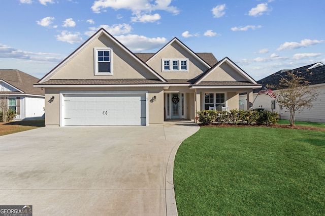 view of front of house with a garage and a front lawn