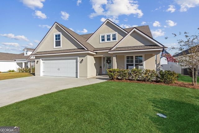 view of front facade with a garage and a front yard