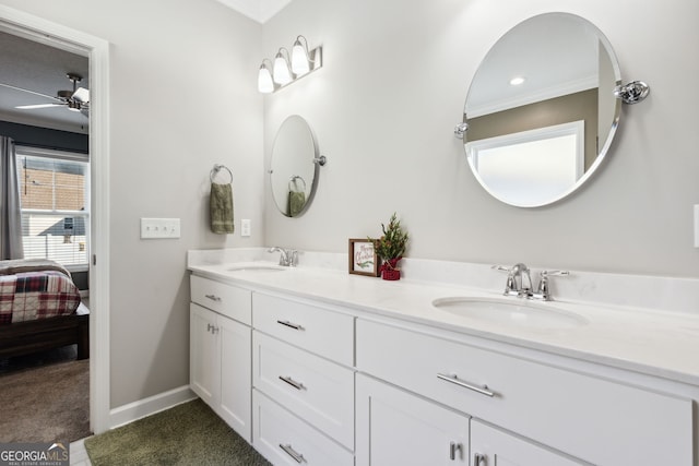 bathroom featuring vanity, ceiling fan, and crown molding