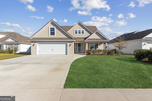 view of front of home featuring a garage and a front yard