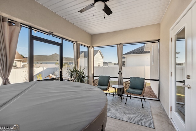 bedroom with ceiling fan and wooden ceiling