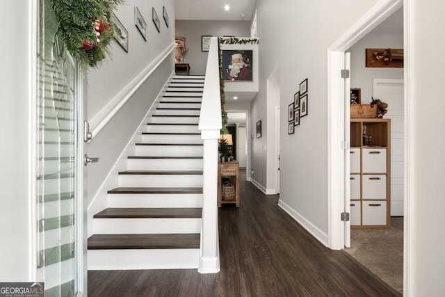 staircase with wood-type flooring