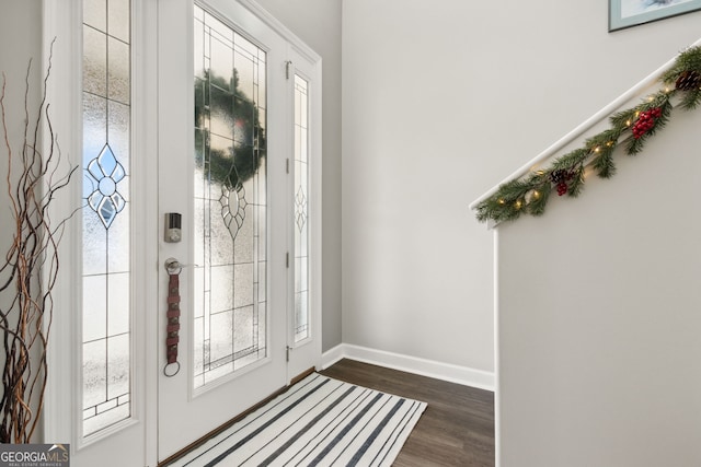 foyer entrance with dark hardwood / wood-style floors