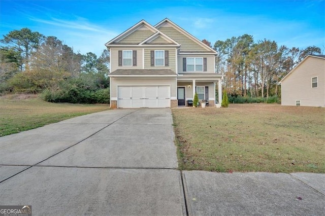 view of front of house featuring a garage and a front yard