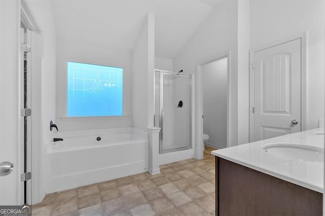 full bathroom with vanity, independent shower and bath, lofted ceiling, and toilet