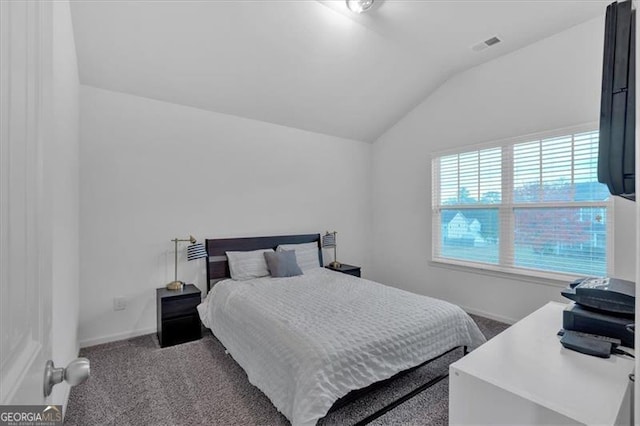 bedroom featuring carpet floors and vaulted ceiling