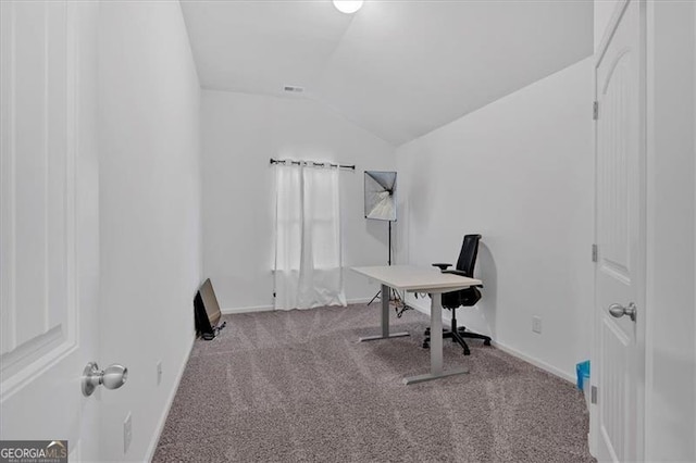 office space featuring light colored carpet and lofted ceiling