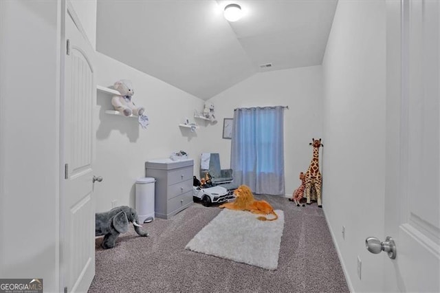 home office with carpet floors and vaulted ceiling