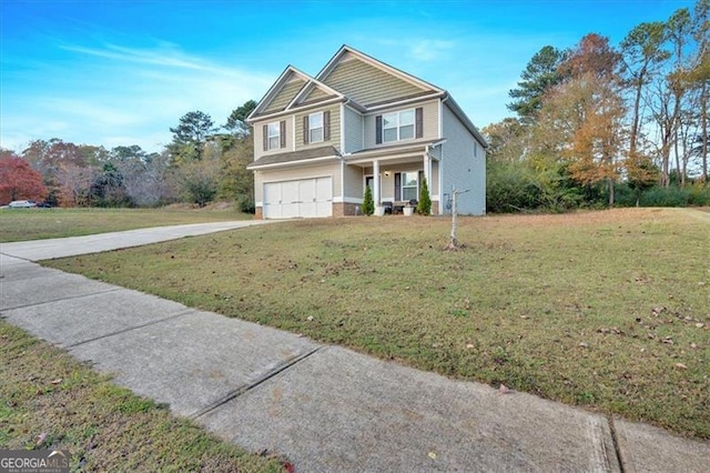 view of front of home with a garage and a front yard