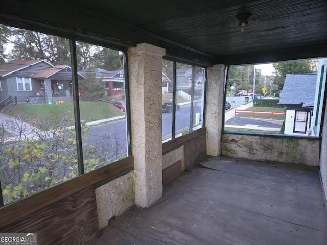 unfurnished sunroom featuring a healthy amount of sunlight